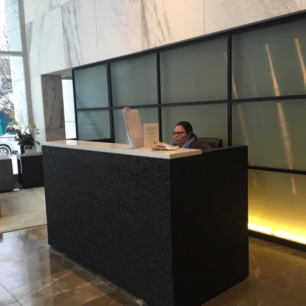 Custom cast terrazzo reception desk in a commercial lobby