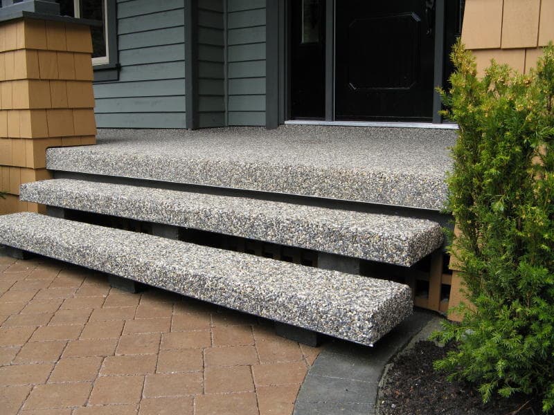 Custom-poured terrazzo entry steps at a residential home entrance