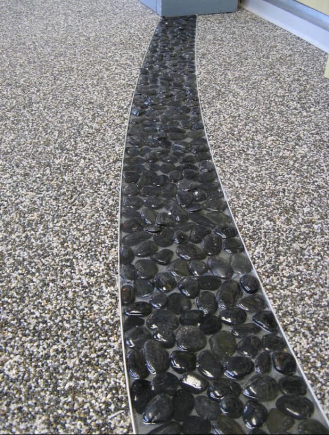 Clear textured terrazzo with natural river stones