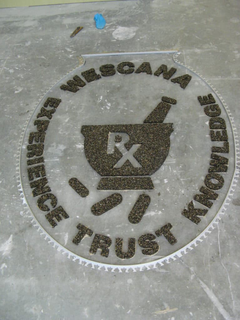 Custom terrazzo floor logo for a pharmacy